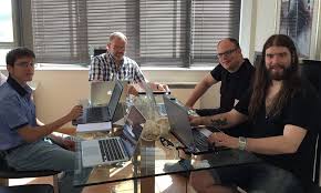 men looking at screen